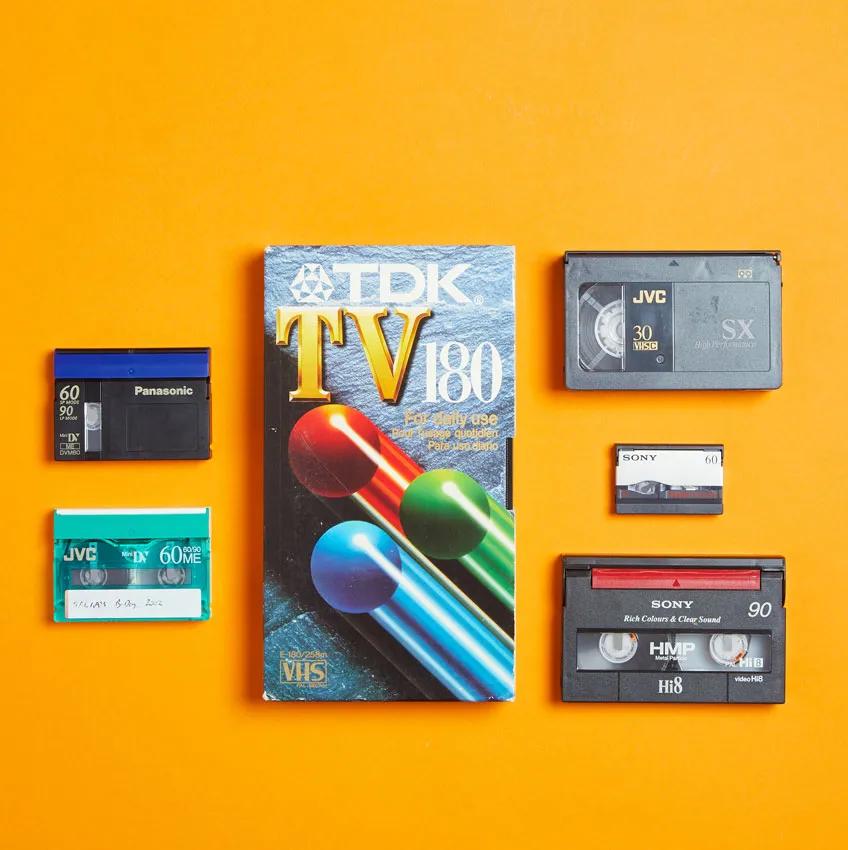 Video tapes on an orange background